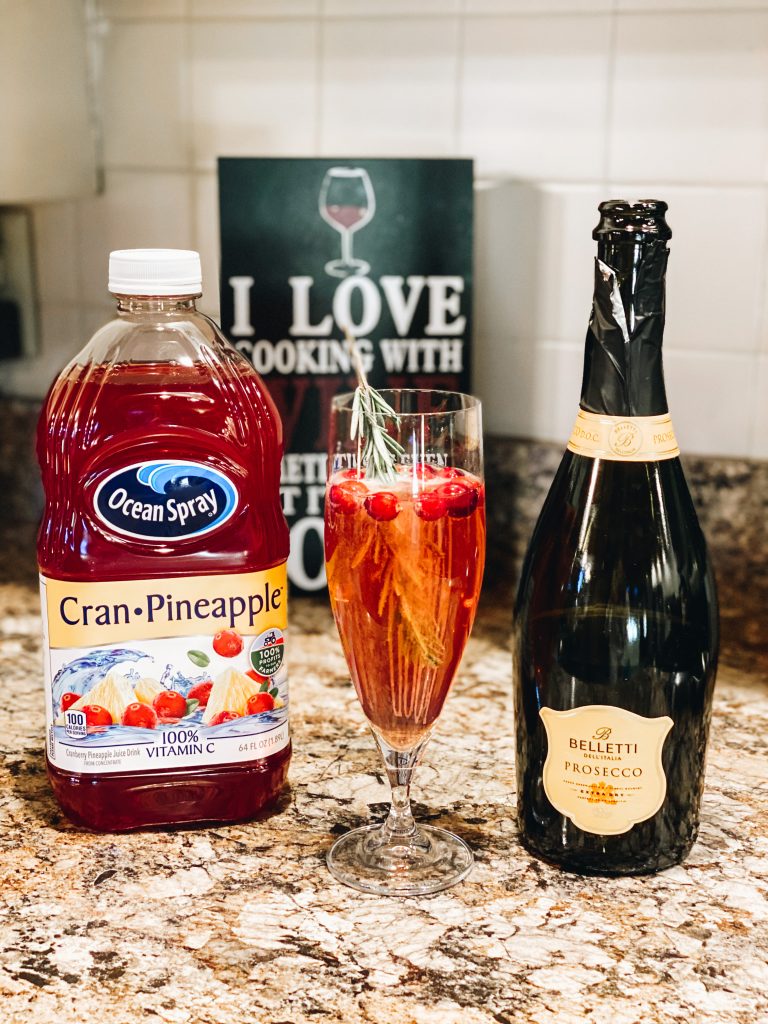 Festive Christmas Poinsettia Cocktail Recipe featured by top Pittsburgh lifestyle blogger, Fashionably Late Mom