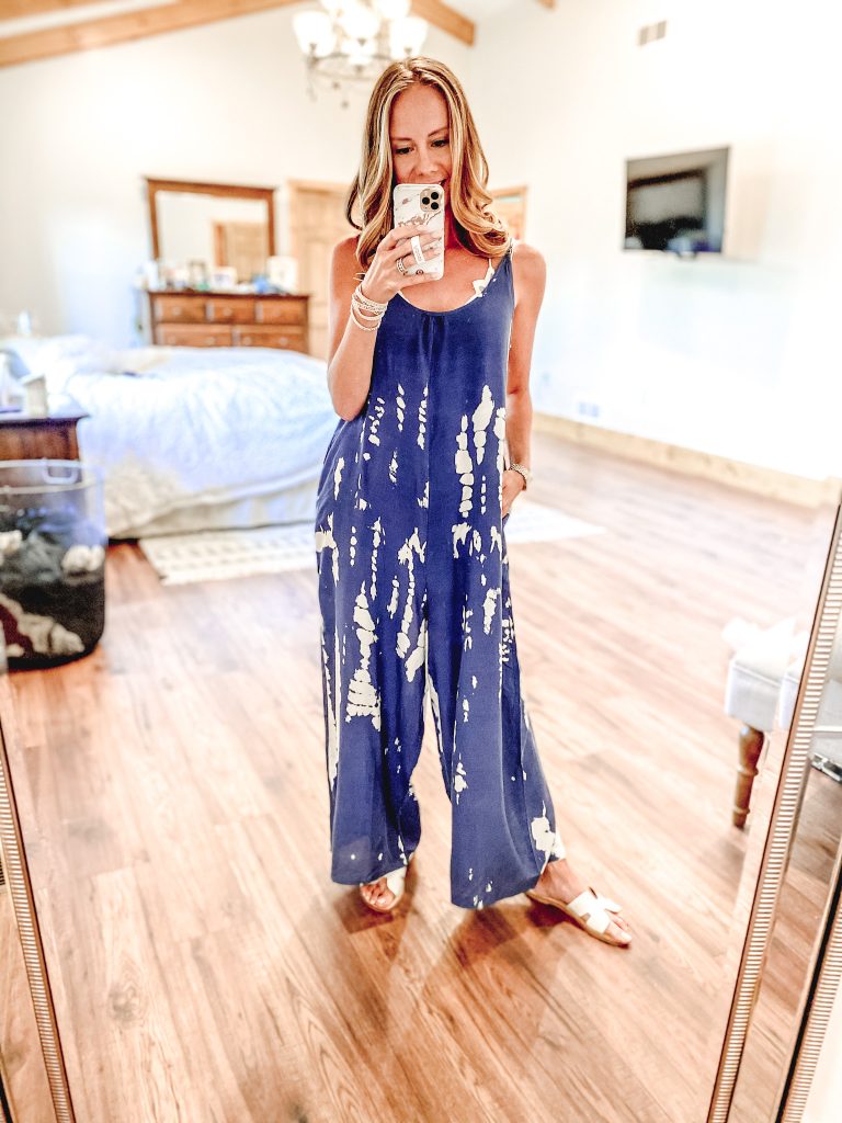 Top 7 Cute Spring Sandals for Women featured by top Pittsburgh fashion blogger, Fashionably Late Mom.|Spring Sandals by popular Pittsburgh fashion blog, Fashionably Late Mom: image of a woman wearing a blue and white tie dye jumper and white slide sandals.