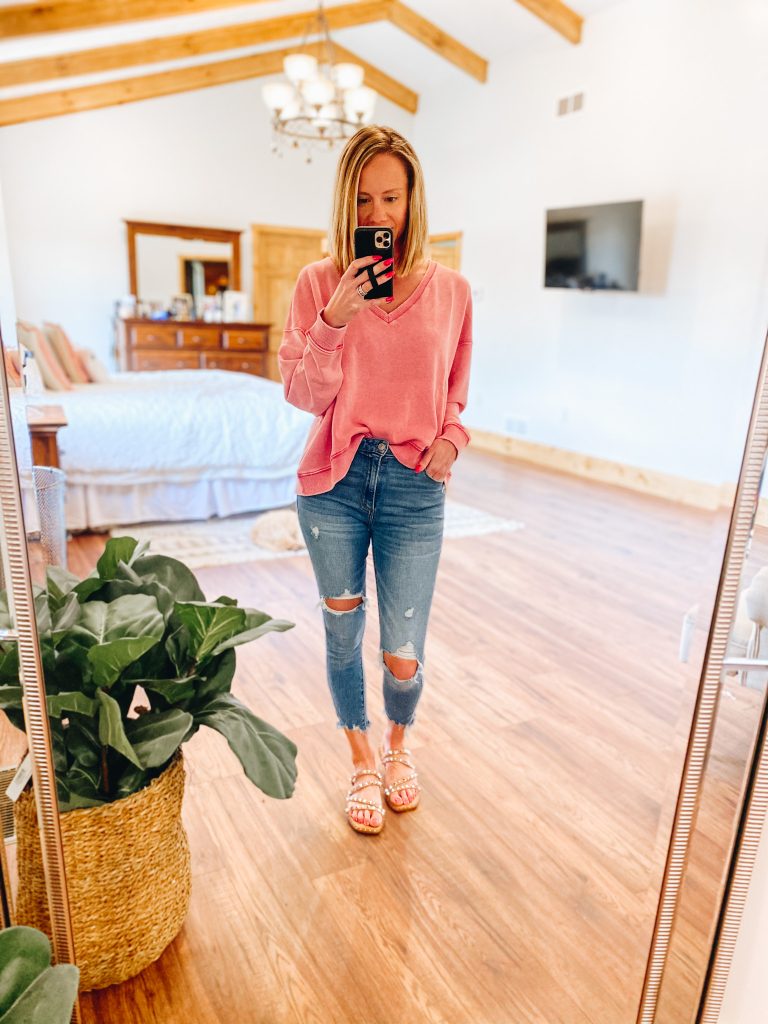 Top 7 Cute Spring Sandals for Women featured by top Pittsburgh fashion blogger, Fashionably Late Mom. |Spring Sandals by popular Pittsburgh fashion blog, Fashionably Late Mom: image of a woman wearing a pink v-neck sweatshirt, deconstructed denim, and slide sandals. 