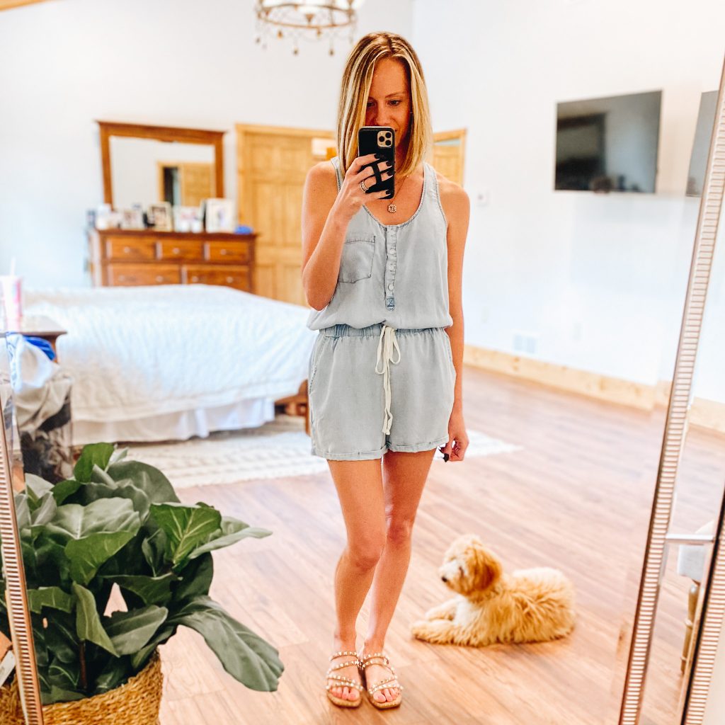 Pink Lily Boutique Favorites for Spring and Summer featured by top Pittsburgh fashion blogger, Fashionably Late Mom |  Pink Lily Boutique by popular Pittsburg fashion blog, Fashionably Late Mom: image of a woman wearing a Pink Lily Boutique chambray romper with studded strap slide sandals. 