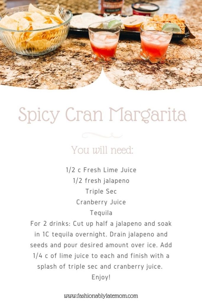 Cranberry Margarita by popular Pittsburg lifestyle blog, Fashionably Late Mom: image of a digital spicy cranberry margarita recipe. 