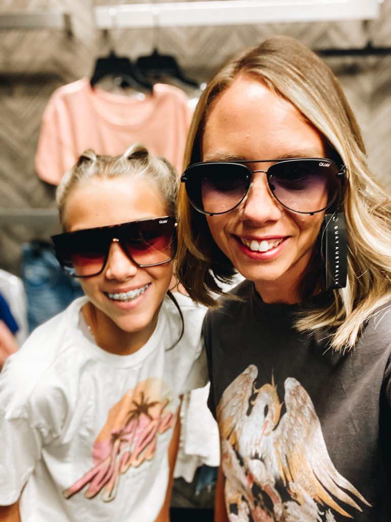 Nordstrom Anniversary Sale 2021: Try On Edition featured by top Pittsburgh fashion blogger, Fashionably Late Mom | Nordstrom Anniversary Sale by popular Pittsburgh fashion blog, Fashionably Late Mom: image of a woman and her teenage daughter wearing a Nordstrom designer sunglasses and graphic t-shirt. 
