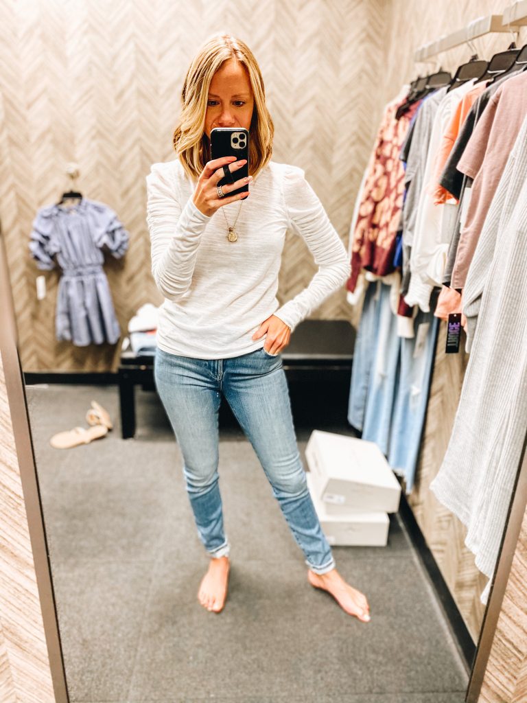 Nordstrom Anniversary Sale 2021: Try On Edition featured by top Pittsburgh fashion blogger, Fashionably Late Mom | Nordstrom Anniversary Sale by popular Pittsburgh fashion blog, Fashionably Late Mom: image of a woman wearing a Nordstrom white long sleeve shirt and light wash jeans. 