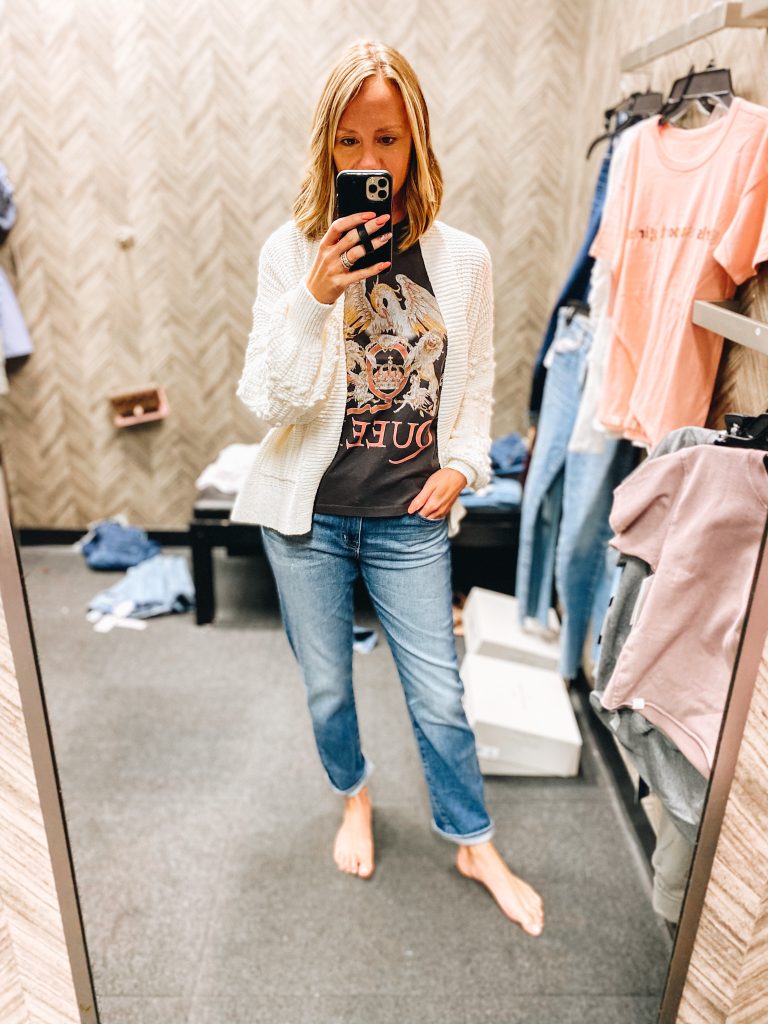 Nordstrom Anniversary Sale 2021: Try On Edition featured by top Pittsburgh fashion blogger, Fashionably Late Mom | Nordstrom Anniversary Sale by popular Pittsburgh fashion blog, Fashionably Late Mom: image of a woman wearing a Nordstrom cream knit cardigan, Queen graphic t-shirt, and light wash jeans. 
