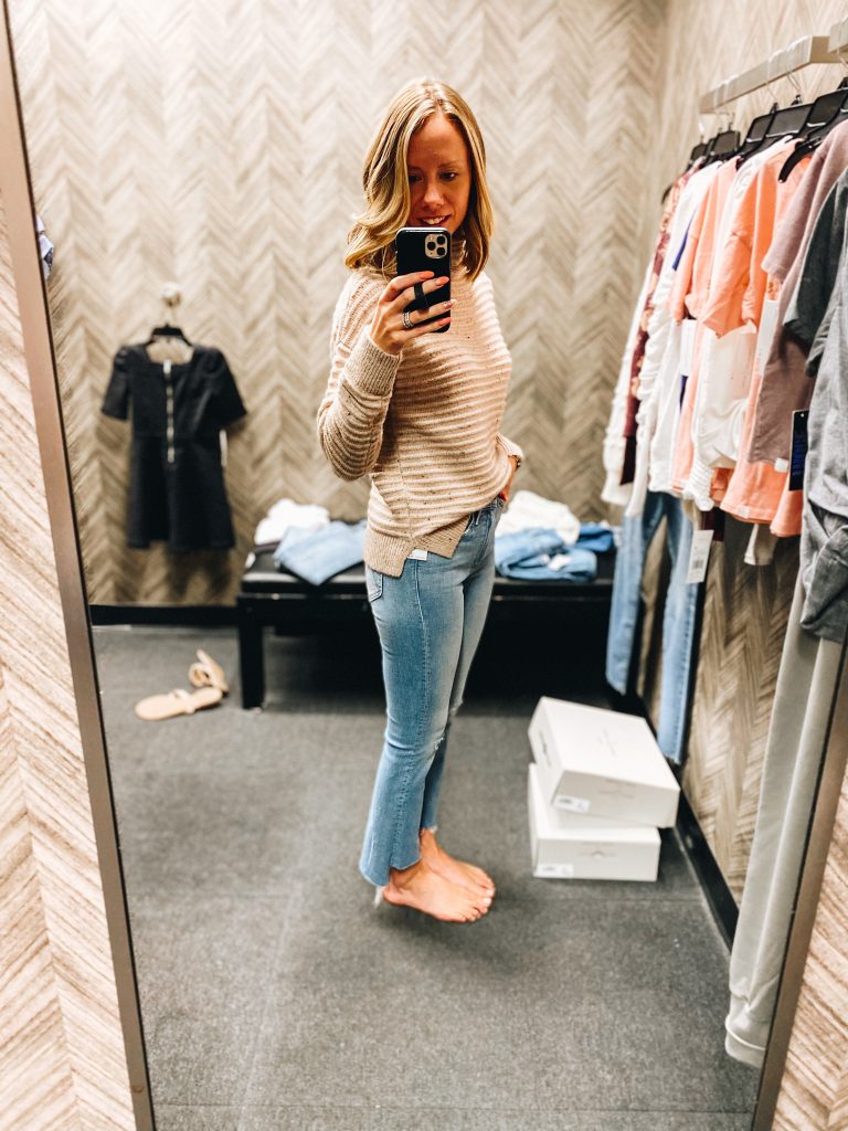 Nordstrom Anniversary Sale 2021: Try On Edition featured by top Pittsburgh fashion blogger, Fashionably Late Mom | Nordstrom Anniversary Sale by popular Pittsburgh fashion blog, Fashionably Late Mom: image of a woman wearing a Nordstrom tan and brown stripe sweater and light wash ankle jeans. 