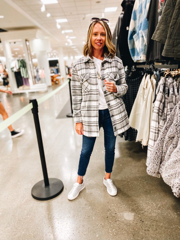 Nordstrom Anniversary Sale 2021: Try On Edition featured by top Pittsburgh fashion blogger, Fashionably Late Mom | Nordstrom Anniversary Sale by popular Pittsburgh fashion blog, Fashionably Late Mom: image of a woman wearing a Nordstrom grey and white plaid shacked white shirt, dark wash jeans, and white sneaker. 