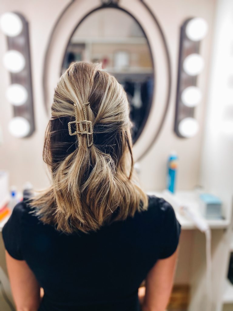 half up claw clip hairstyle | Claw Clip Hairstyles by popular Pittsburgh fashion blog, Fashionably Late Mom: image of a woman with a half up claw clip hairstyle.  