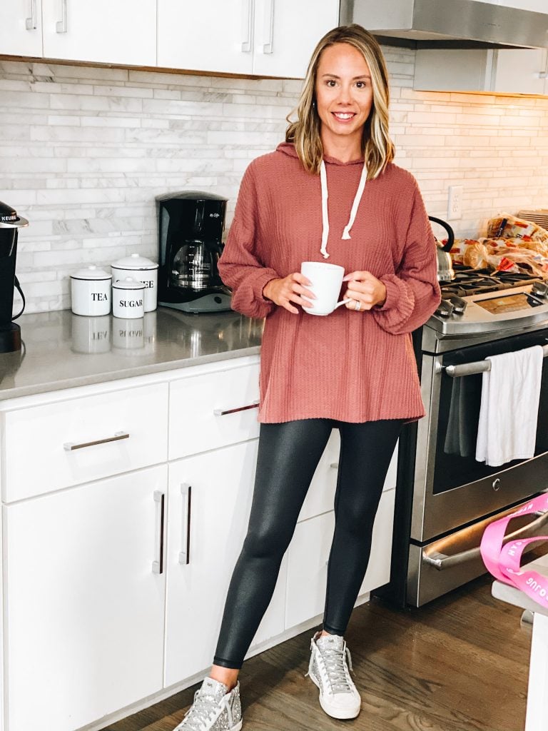 loungewear, fall style, hoodie, faux leather leggings, pink lily | Pink Lily by popular Pittsburgh fashion blog, Fashionably Late Mom: image of a woman wearing a Pink Lilly faux leather leggings, sneakers, and hoodie pullover. 