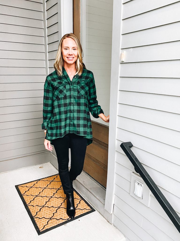 Pink Lily by popular Pittsburgh fashion blog, Fashionably Late Mom: image of a woman wearing a Pink Lilly  green and black buffalo plaid button up, black jeans, and black ankle boots. 