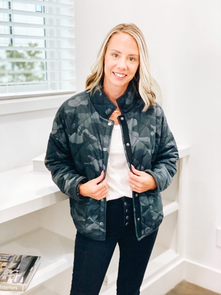 bomber jacket, pink lily, fall style, athleisure | Pink Lily by popular Pittsburgh fashion blog, Fashionably Late Mom: image of a woman wearing a Pink Lilly camo bomber jacket, button up jeans, and white t-shirt. 