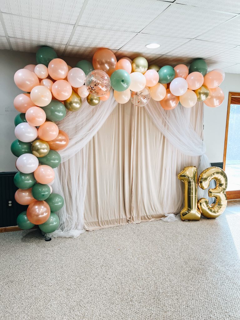 how to decorate for a teen girl birthday, balloon arch, boho chic birthday party, floor table, amazon party decor