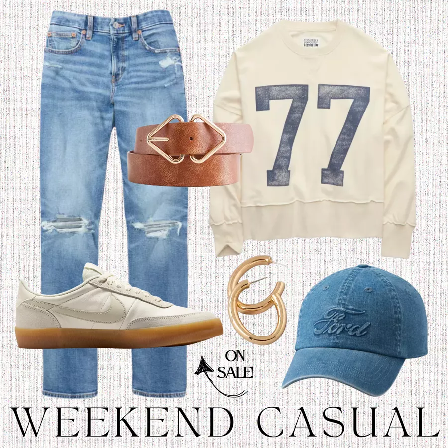 Outfit flat lay featuring light blue distressed jeans, a cream sweatshirt with a navy '77' print, a brown belt, gold hoop earrings, a blue denim cap, and white sneakers with a gum sole, titled 'Weekend Casual'.