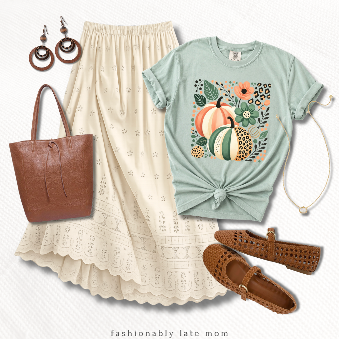 pumpkin graphic tee outfit with a cream eyelet midi skirt and brown accessories