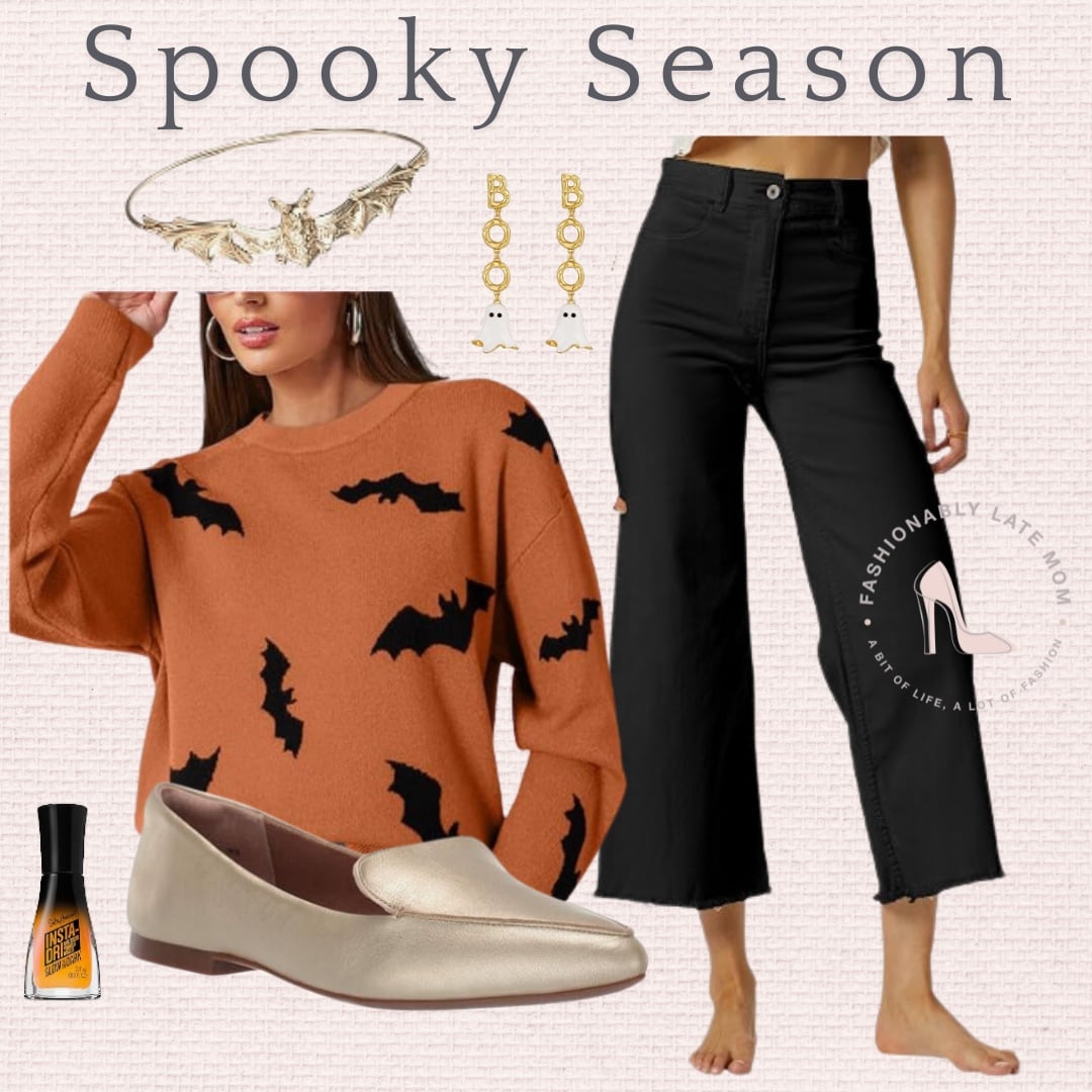 Orange bat print sweater with black cropped wide leg pants and gold flats