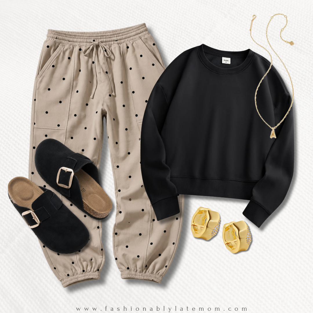 cozy fall loungewear outfit with polka-dot joggers, a black sweatshirt and clogs