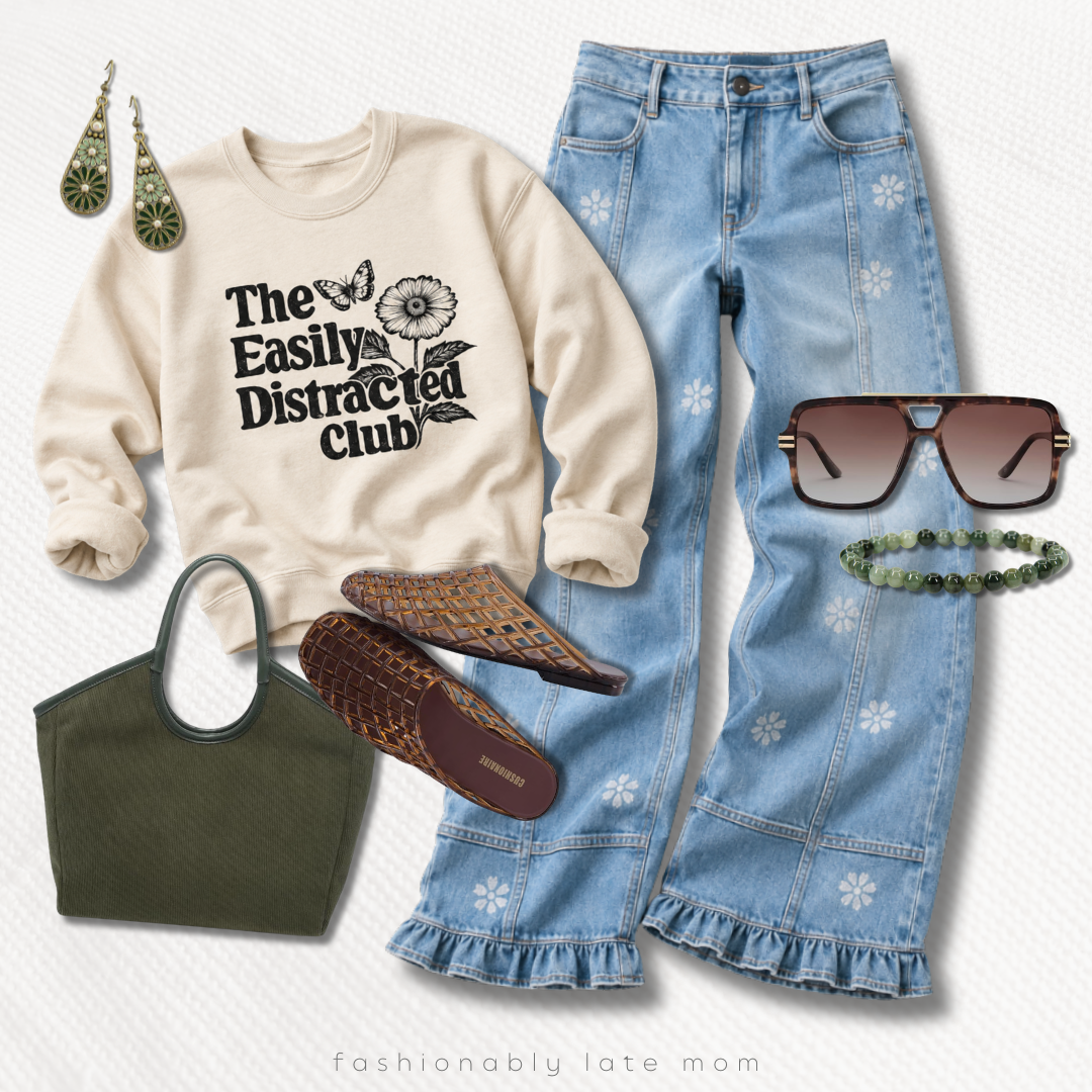 The Easily Distracted Club graphic sweatshirt with ruffle-hem flare jeans, a green tote and sunglasses