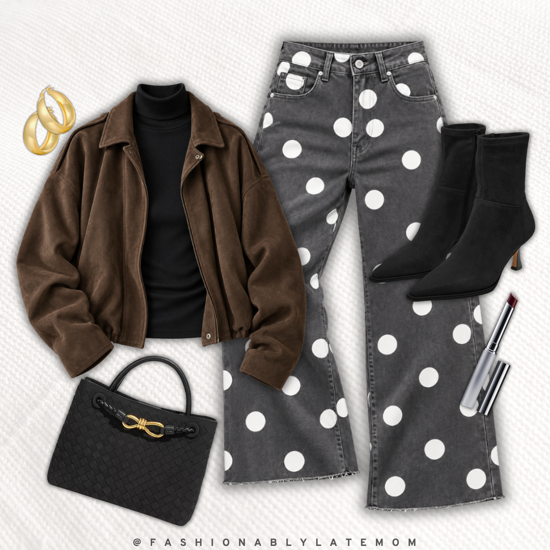 Brown bomber jacket with a black top, polka dot wide leg jeans and black ankle boots