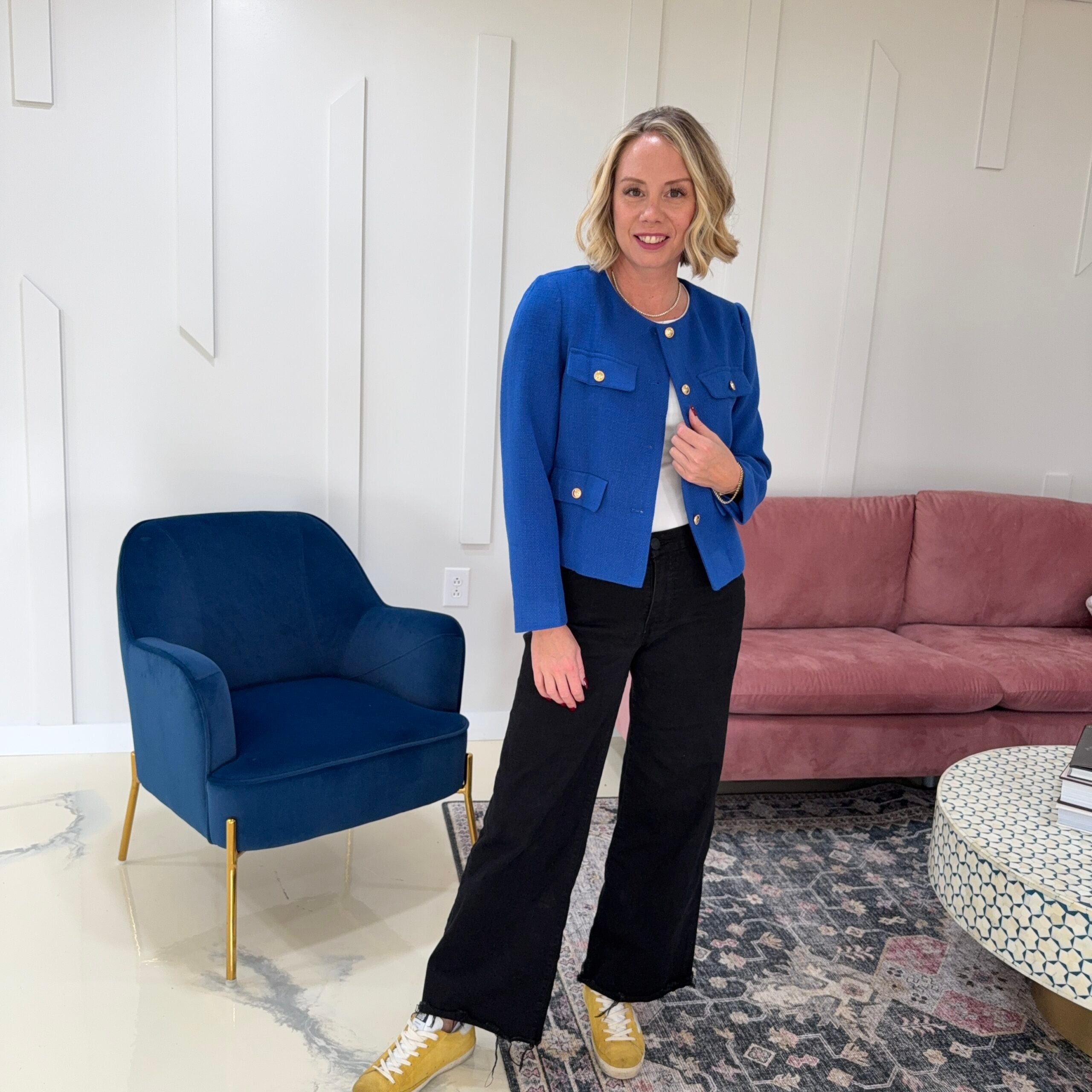 Royal blue tweed jacket with a white tee, black wide leg jeans and yellow sneakers