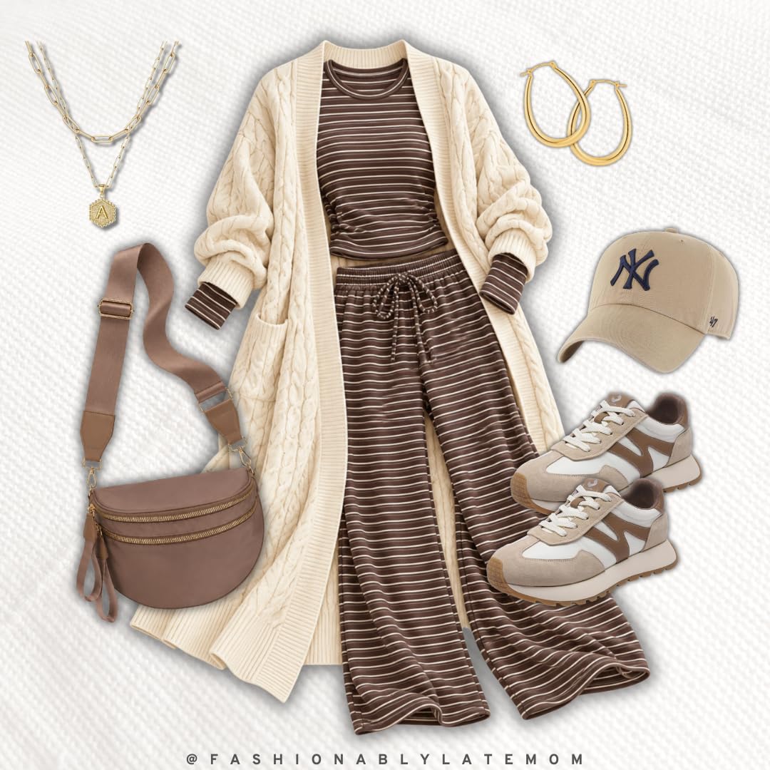 Long cream cable cardigan over a striped lounge set with sneakers and a ball cap